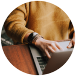 overhead view of person typing on laptop keyboard